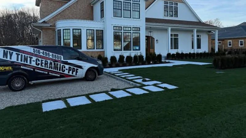 NY Window Tinting van parked in front of a Long Island home during a residential window tinting job